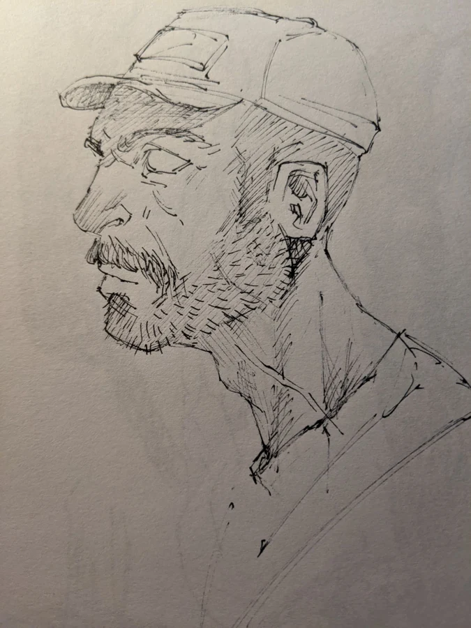 Sketchbook profile of a man wearing a cap