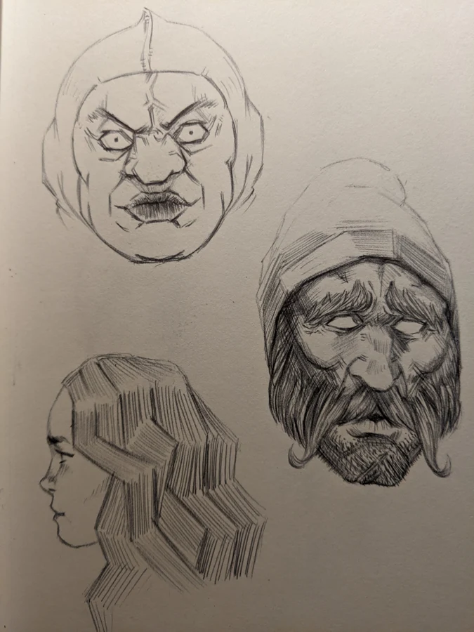 Sketchbook page with faces, a bearded man, and a hand study